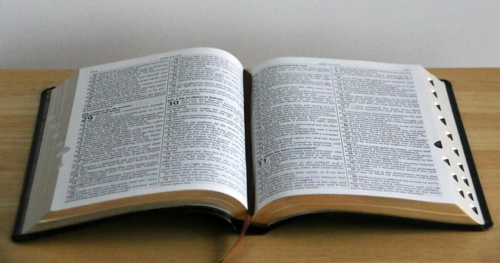 Open Bible on wood table