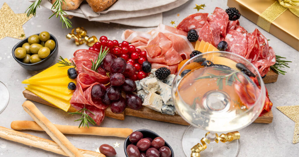Ring in the new year with a festive celebration board featuring bubbly drinks, lucky black-eyed peas, and celebratory bites.