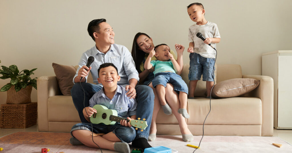 Family learning about God through the gift of music at home.